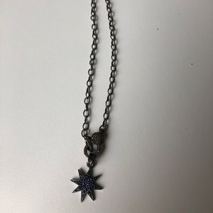 Black pave diamond necklace with dark blue charm